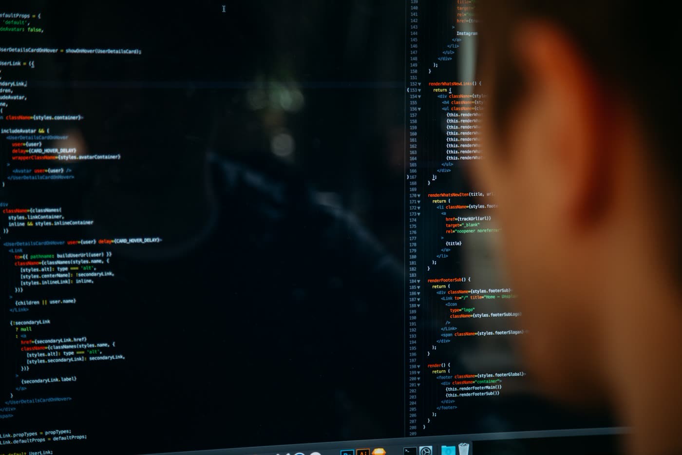 Developer silhouetted against screens of recommendation-system code